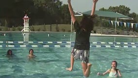 Jen jumps in the pool at Camp Cristina - again