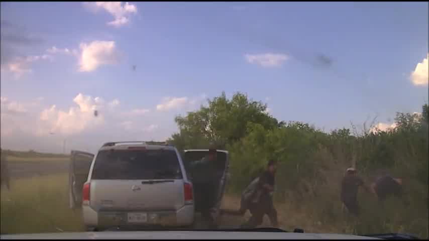 Dashcam video shows illegal immigrants pour out of smuggler's car after police pursuit