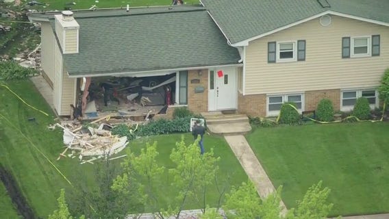 Vehicle crashes through Downers Grove home