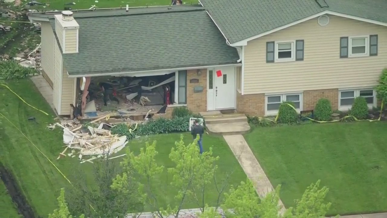 Vehicle crashes through Downers Grove home