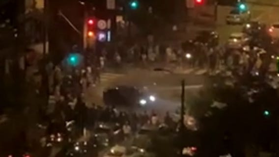 Video shows car doing donuts amid large crowds in West Loop intersection