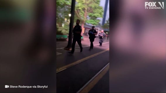 Police seen running into Six Flags amusement park amid shooting