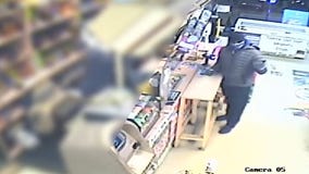 Surveillance video shows gunman in killing of liquor store owner