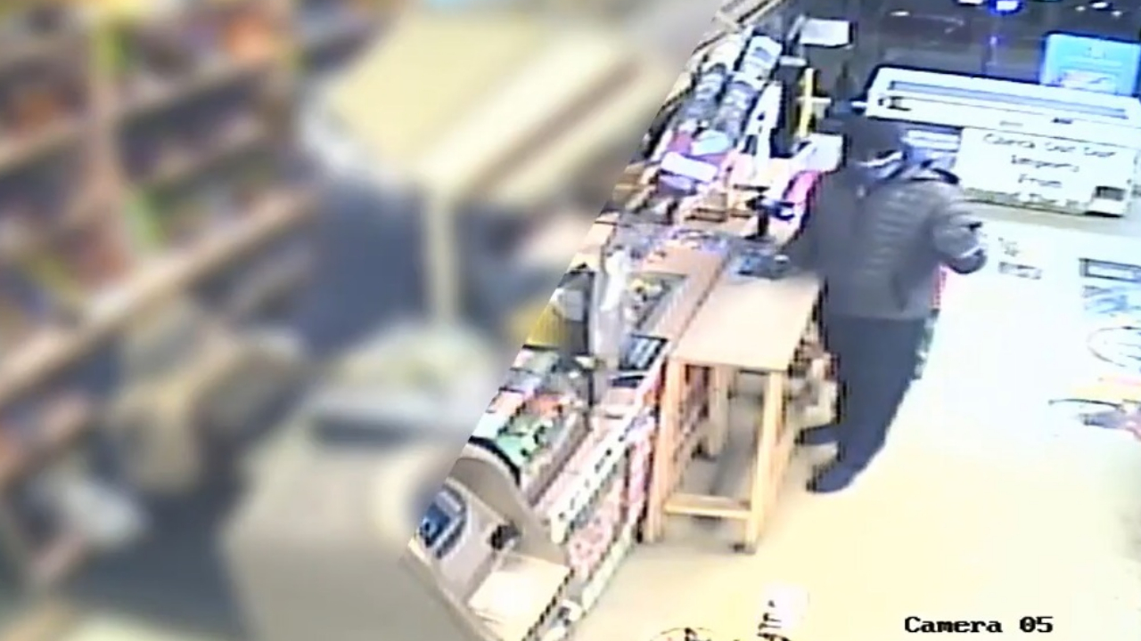Surveillance video shows gunman in killing of liquor store owner
