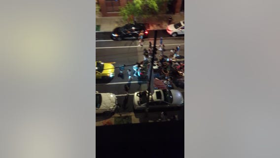 Video captures group of people jumping on car in Lake View