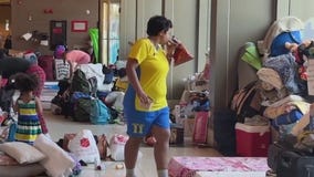 New migrant shelter to open at Lake Shore Hotel as video shows more migrants sleeping in police stations