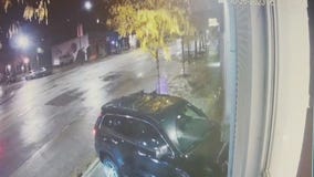 Video captures SUV crashing into Chicago business