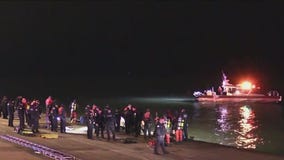 Car drives off LSD into Lake Michigan, driver flees
