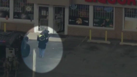 3 in custody after SWAT standoff at suburban liquor store