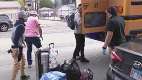 Migrant families move into West Town shelter amid controversy