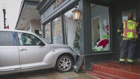 Car crashes into suburban store, shattering window: police