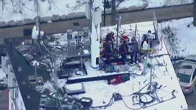 Crews working to rescue contractor on roof of Frankfort Grainery tower