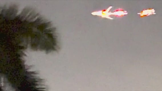 'Oh my God!' Plane with flames shooting from engine streaks through sky