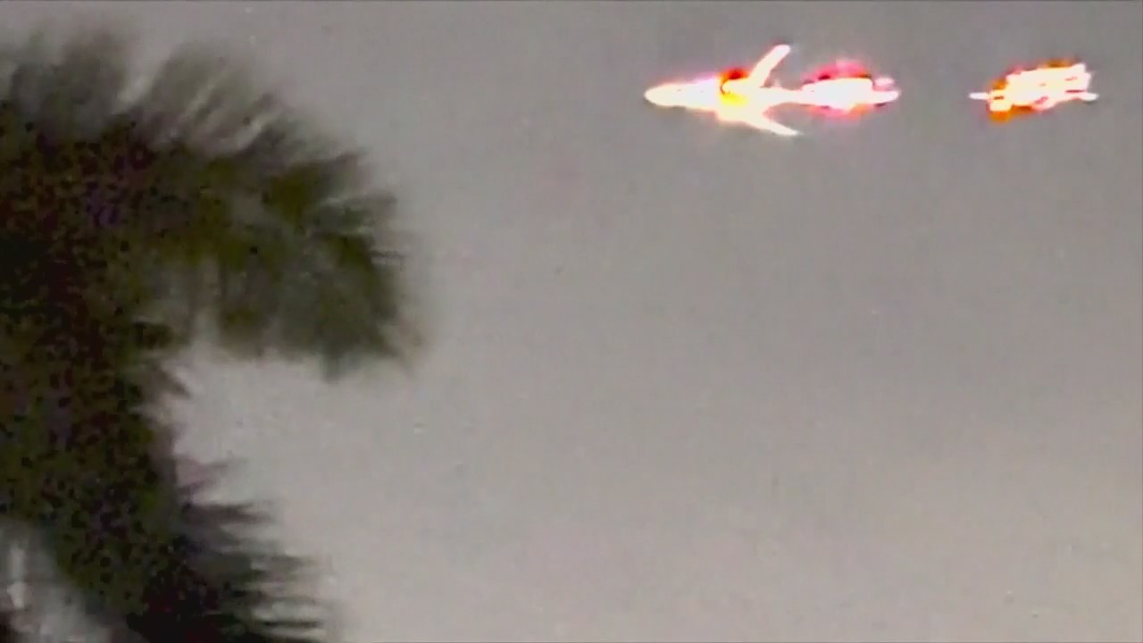 'Oh my God!' Plane with flames shooting from engine streaks through sky