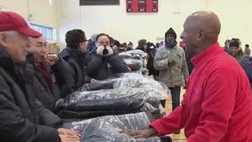 Jesse White helps hand out over 500 winter coats to those in need