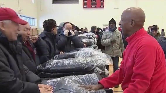 Jesse White helps hand out over 500 winter coats to those in need