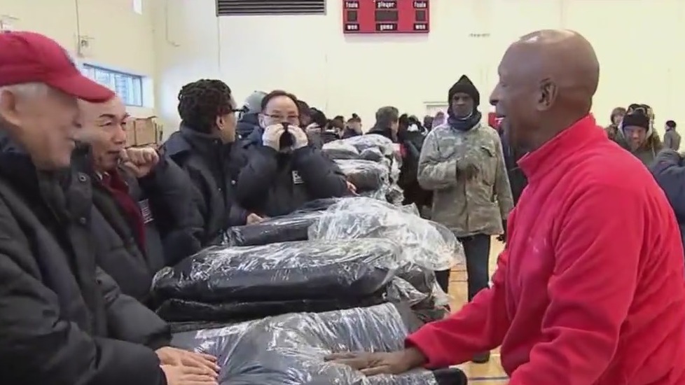 Jesse White helps hand out over 500 winter coats to those in need