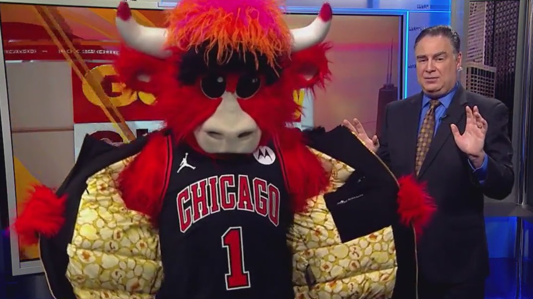 Benny the Bull helps Mike Caplan with the weather