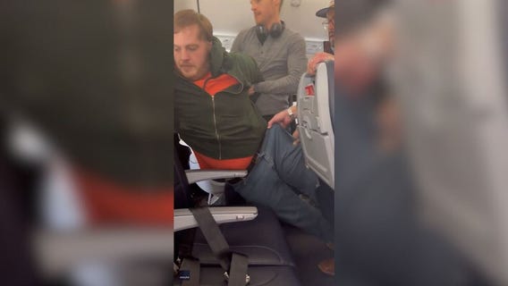 Man tries to open plane door on American Airlines flight to Chicago