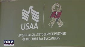 Members of the military take part in boot camp at One Buc Place