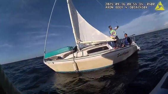 Deputies rescue men & dog from boat