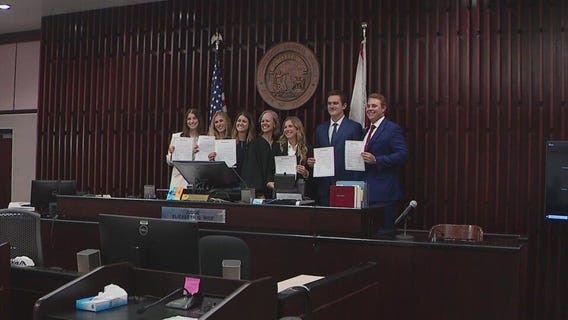 Judge swears in daughter, fellow graduates
