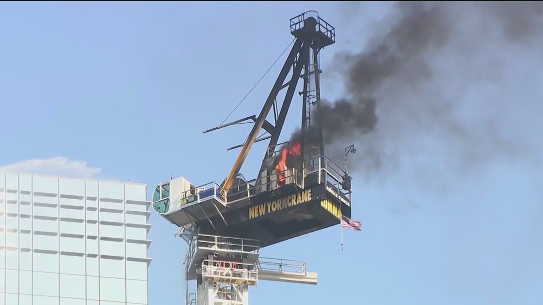 Crane catches fire, partially collapses