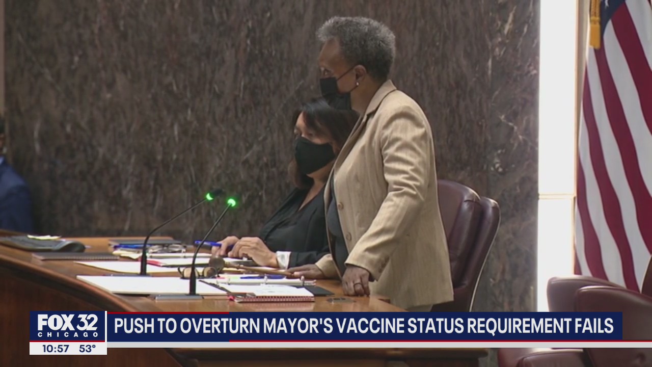 Judge denies Chicago workers' bid to halt reporting vaccine status