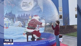Safe Santa: Old St. Nick in a snow globe amid COVID concerns