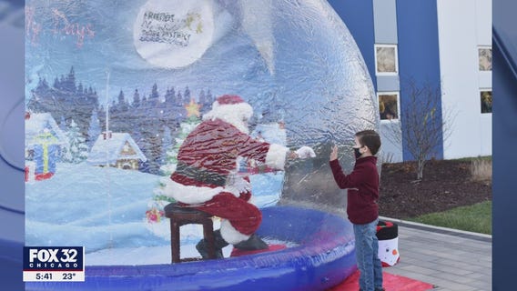 Safe Santa: Old St. Nick in a snow globe amid COVID concerns