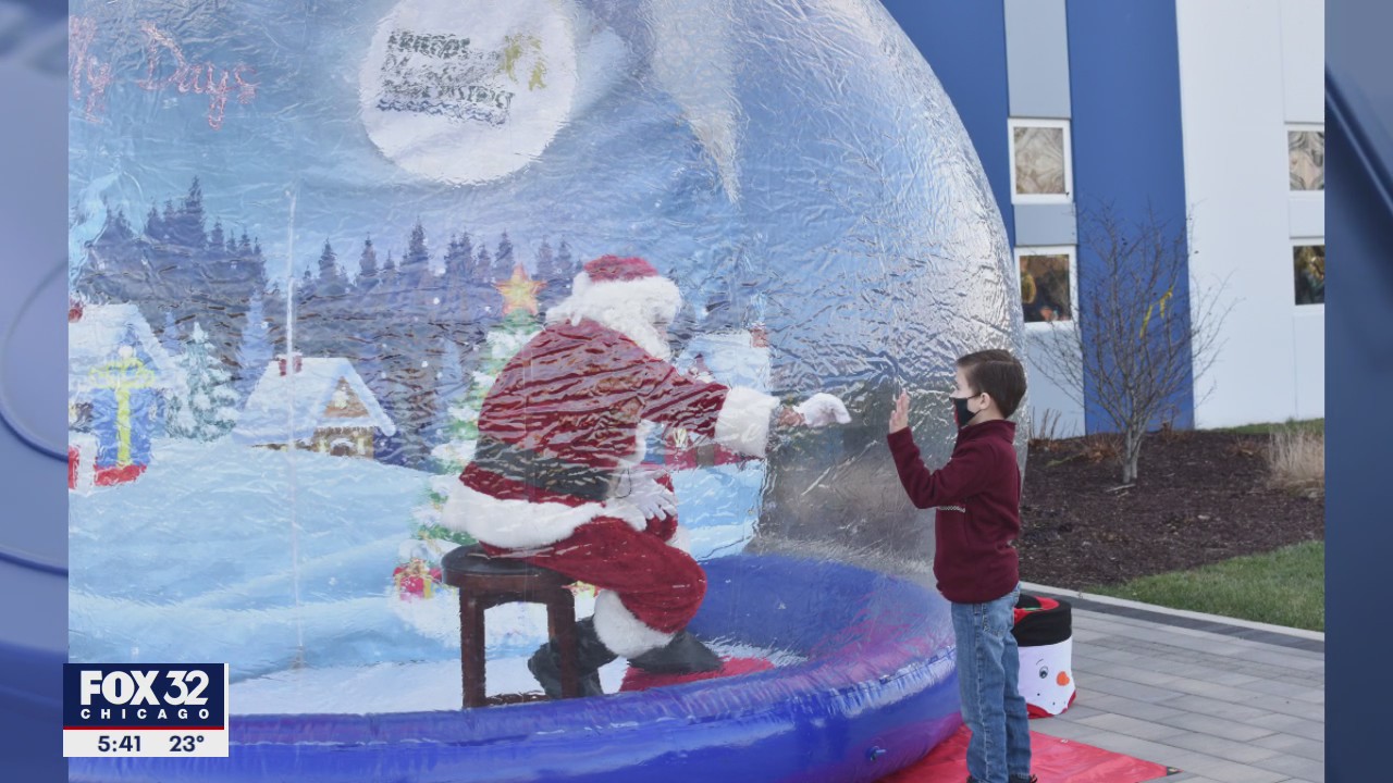 Safe Santa: Old St. Nick in a snow globe amid COVID concerns