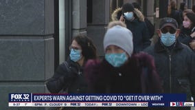 Experts warn against people getting COVID intentionally to 'get it over with'