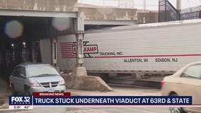 Truck stuck underneath viaduct in Chicago's Grand Crossing