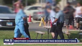 1 of 2 brothers charged after bodies found buried in Lyons