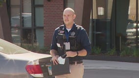 Highland Park man charged after pair found dead in suburban home