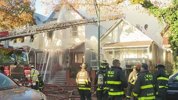 Extra-alarm fire spreads to three homes in Logan Square