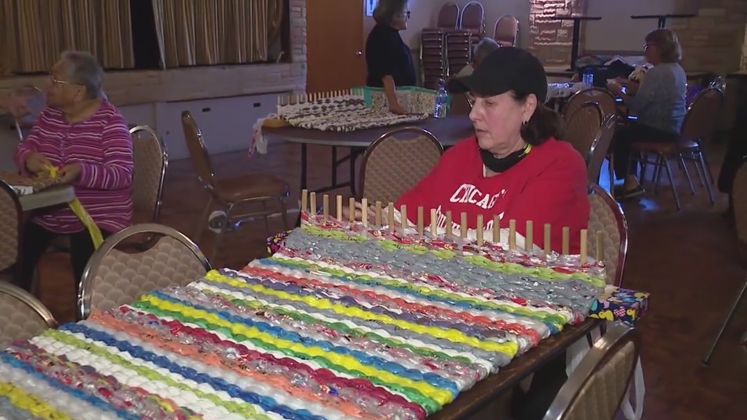 Chicago women fashion sleeping mats for homeless out of plastic bags