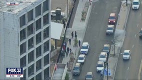 Man, woman found shot to death in car on Chicago's West Side; cop injured controlling crowd at the scene