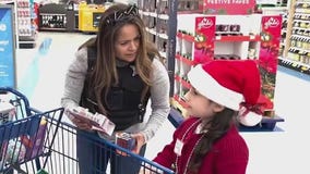 Boy who was saved from icy retention pond among participants at Aurora's Shop with a Cop