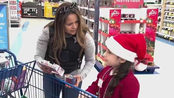 Boy who was saved from icy retention pond among participants at Aurora's Shop with a Cop