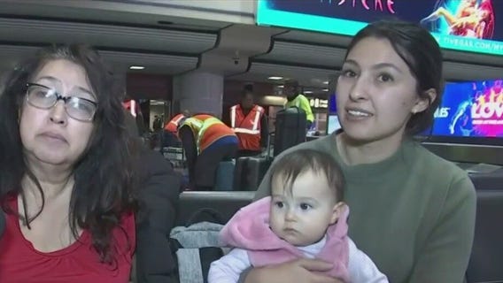 Family celebrates baby's first Christmas stranded at airport