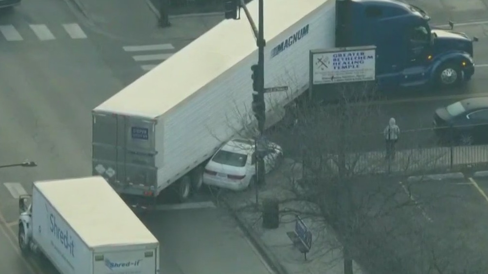 Semi collides with sedan while turning on Near West Side