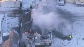 Fire crews break through blaze at south suburban home