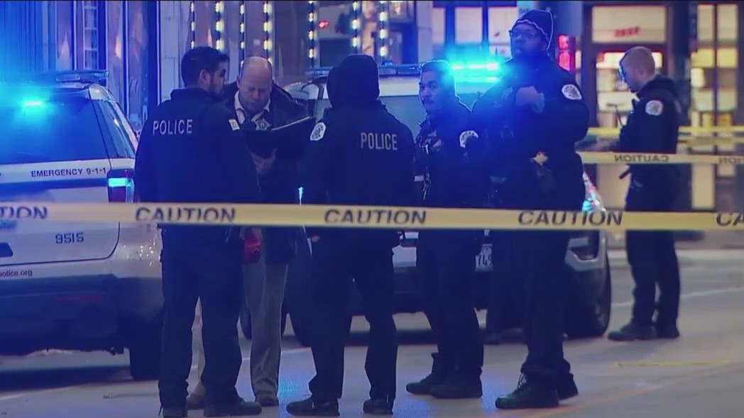 2 shot while inside Chicago business