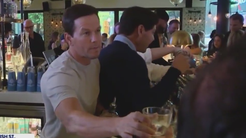 Mark Wahlberg bartends at The Bellevue in Chicago