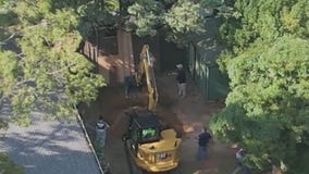 Excavator digging at Rex Heuermann's home