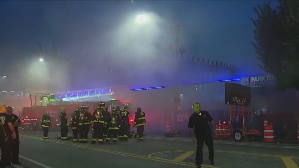 Firefighters battle Chinatown store fire in excessive heat