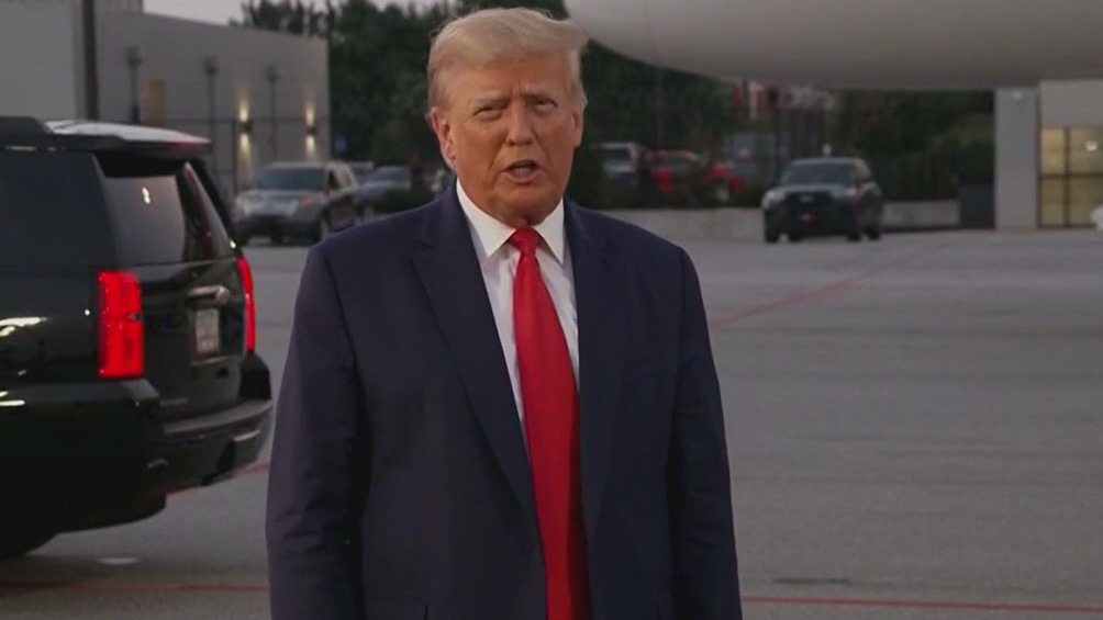 Trump defiant after arrest, claims election stolen