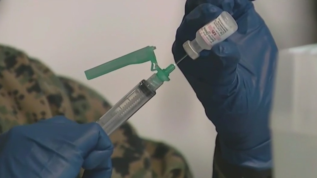 Controversy over new COVID-19 vaccine as cases spike