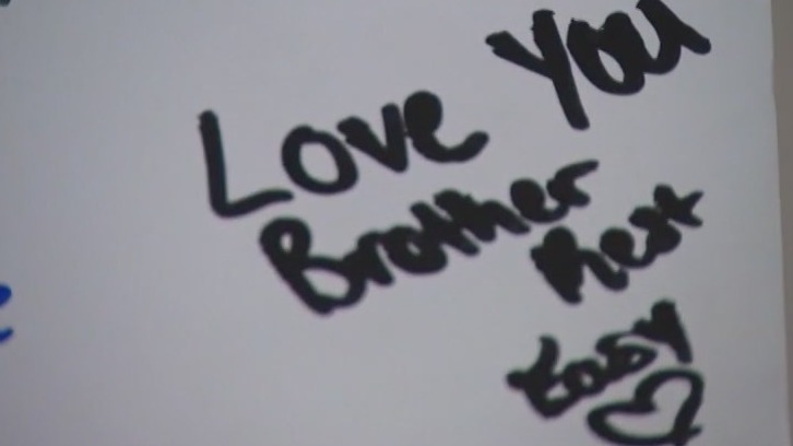 Vigil held for suburban student killed after homecoming game